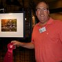 Richard Holliday with his 2nd place photo, "Grist Mill and Red Maple."   (Photo by Jeanne Tompkins)